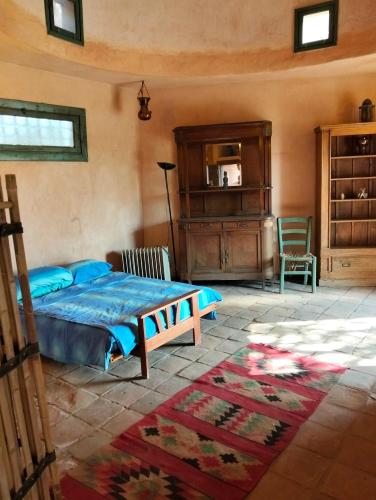 a bedroom with a bed and a dresser at Chalet besides sakkara piramid in Cairo