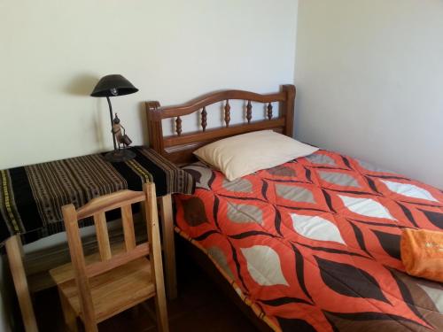 Кровать или кровати в номере Villa Oropeza Hostel