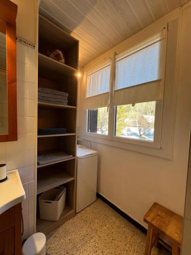 a bathroom with a toilet and a window in it at L'appart de Serre Che in La Salle-les-Alpes
