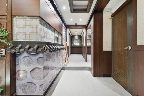 a hallway of a building with a door at Bokman stay 01 in Seoul