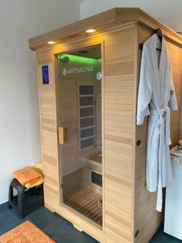 a shower stall in a bathroom with a towel at Lakeview Apartment & Spa in Belosavci