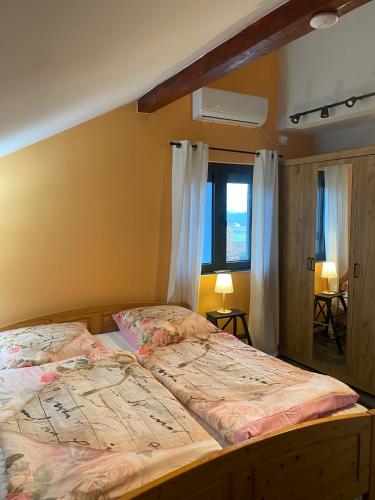 a bedroom with a bed with a map on it at Lakeview Apartment & Spa in Belosavci
