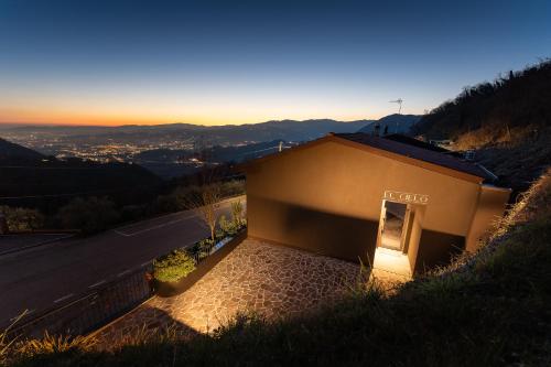 a small building on the side of a hill at El Cielo - Rooms with Panoramic View & El Carnicero Restaurant in Cornedo Vicentino
