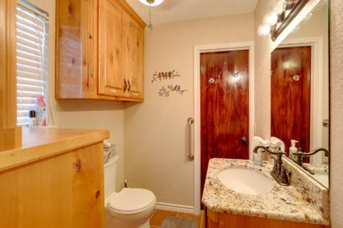 a bathroom with a sink and a toilet in it at Papas Lakefront Hideaway in Chico