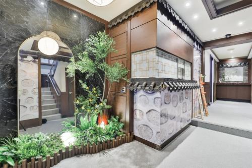 an indoor garden in the lobby of a house at MIIN Stay02 in Seoul