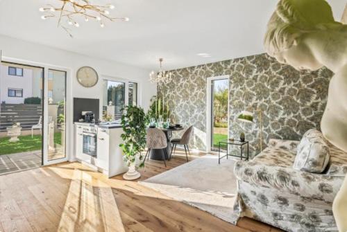a living room with a couch and a table at Luxury Long-Term Apartment with Terrace in Vienna