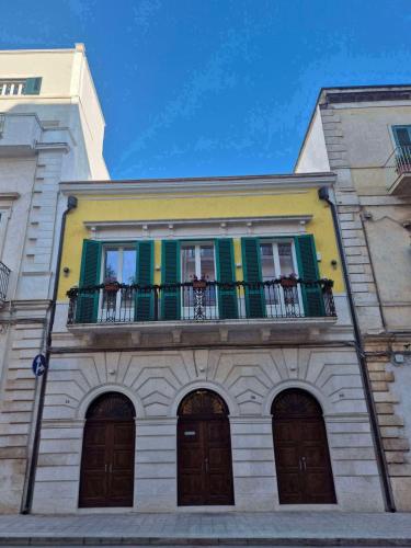 a building with a balcony on top of it at Casa Tanina in Bitonto