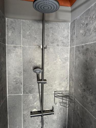 a shower with two lights in a bathroom at Petron home in Kempton Park