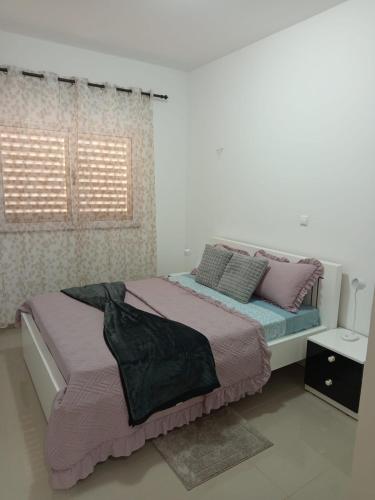 En eller flere senge i et værelse på Casa Melissa