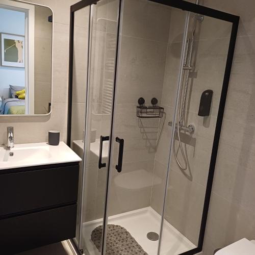 a bathroom with a shower and a sink at Casa Terra das Vinhas in Esposende