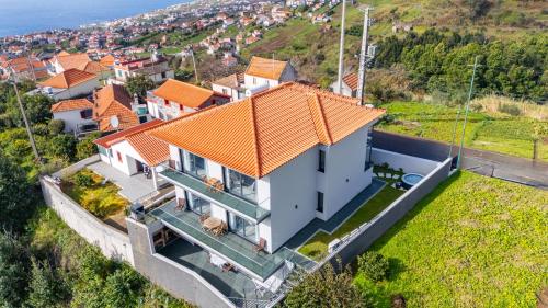 an aerial view of a house with an orange roof at Paradise Pereira House BY YOUR KEY MADEIRA in Calheta