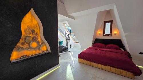 a bedroom with a bed and a fireplace at Urocze Gniazdko pod Tatrami in Ratułów
