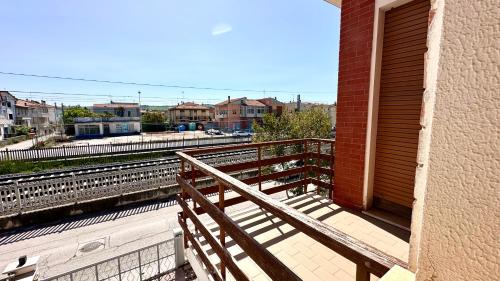 a building with a ramp next to a train station at SE081 - Comodo trilocale a Marotta in Marotta