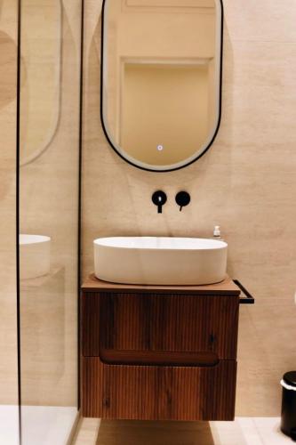 a bathroom with a sink and a mirror at Monti26 in Milan