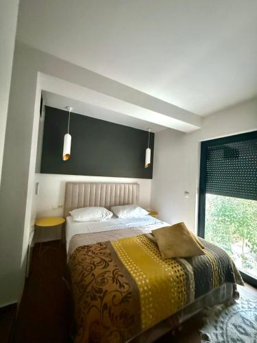 a bedroom with a large bed and a window at La Vela Luxury in Trogir