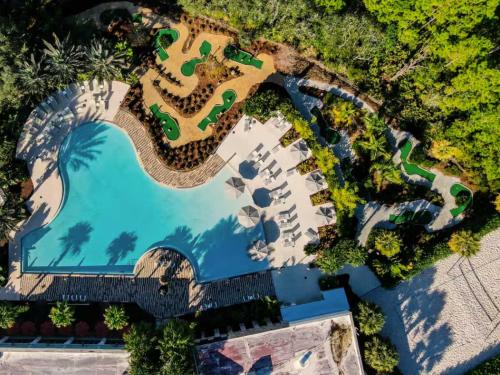 an overhead view of a pool at a resort at 5BR Getaway with Pool Arcade Games and Resort Access in Davenport
