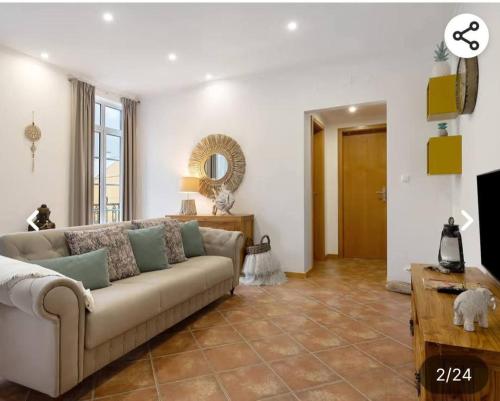 a living room with a couch and a table at House Bali Furnas in Furnas