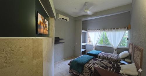 Een bed of bedden in een kamer bij Casa El Limón