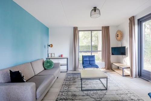 a living room with a couch and a table at 6 - Persoons Forest 185 Bungalow in Ewijk