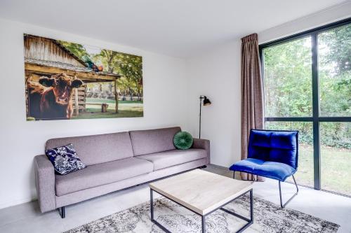 a living room with a couch and a chair at 6 - Persons Forest 287 Bungalow in Ewijk