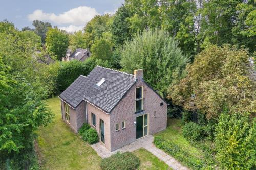 an overhead view of a brick house in the woods at 6 - Persons Forest 287 Bungalow in Ewijk