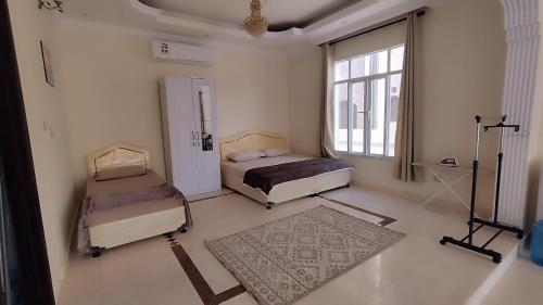 En eller flere senge i et værelse på Raha Hostel