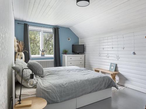 En eller flere senge i et værelse på Det Vita Huset Gubbhögen