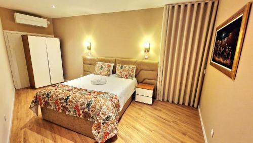 En eller flere senge i et værelse på Cidadela do Viriato Standard