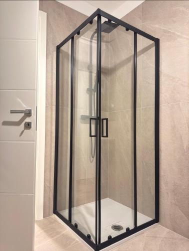 a shower with a glass door in a bathroom at LP House in Rovereto