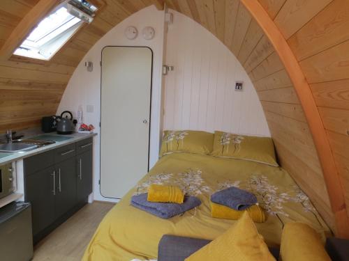 a bedroom with a bed in a small room at Rainbow View in Ellesmere