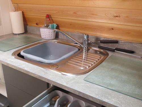 a sink in a kitchen with a counter top at Rainbow View in Ellesmere