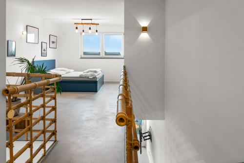 a room with a staircase and a bed at Heimerzheim-Hills in Swisttal