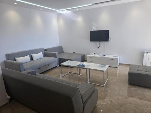 Et opholdsområde på Luxueux Appartement pieds dans l'eau