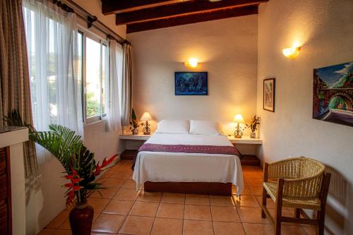 En eller flere senge i et værelse på Hotel Zandoyo Bed & Breakfast