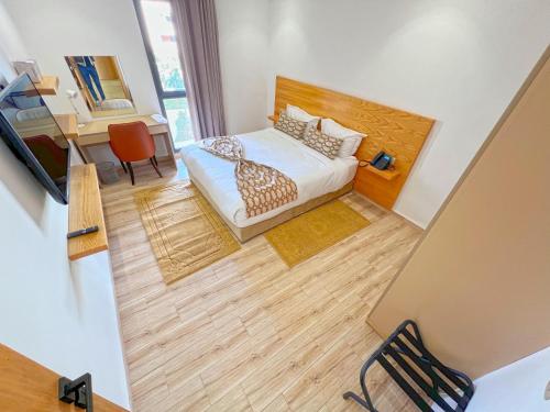 an overhead view of a bedroom with a bed and a desk at Great Holiday suites in Agadir