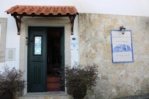 a door to a building with a sign on it at Retiro da Madalena in Crato