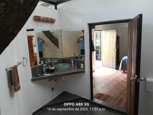 a bathroom with a sink and a mirror at Casa ixcanul in Montitlán