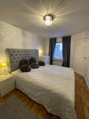 a bedroom with a large bed with a white bedspread at Sunshine apartment in Stockholm
