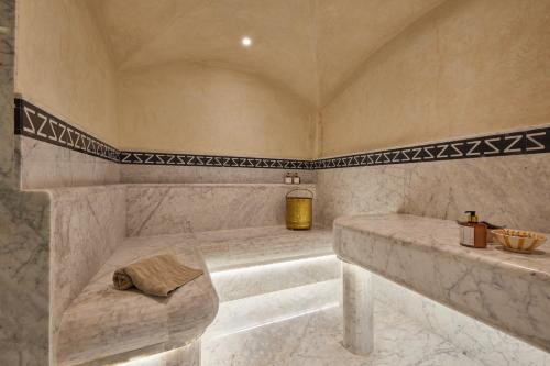 a large bathroom with a tub and a sink at Zen Zone Boutique Riad & Spa in Marrakesh