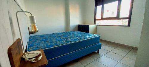 En eller flere senge i et værelse på Edificio Aura con cochera, A mts del shopping, casino y el puerto!!