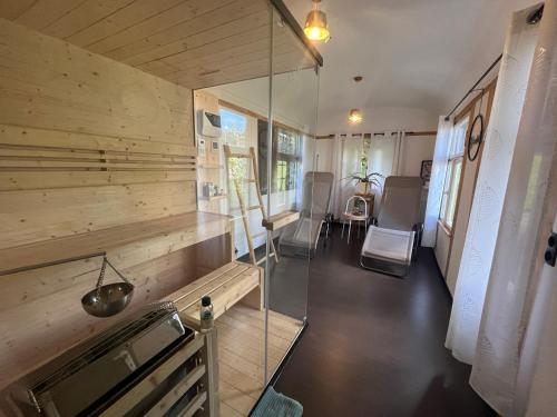a room with a wooden wall with a glass door at Ferienwohnung Rhöner Luft in Bad Brückenau