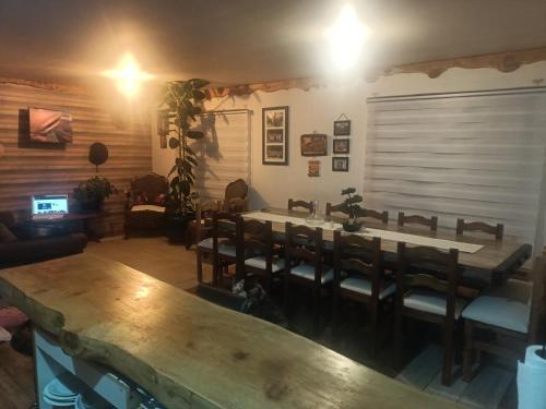 a dining room with a table and chairs at MyE in Frutillar