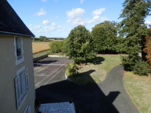 an overhead view of a building with a shadow of a tree at Château Ardilleux in Ardilleux