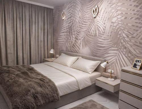 a bedroom with a large bed and a wall at Apartament Corner Cappuccino z wanną z hydromasażem w centrum Tomaszowa! Parliamo anche Italiano! in Tomaszów Mazowiecki
