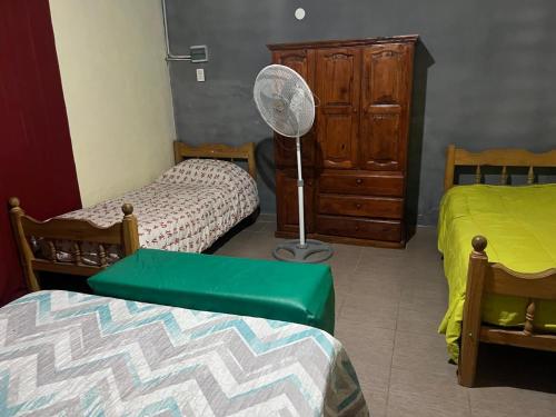 En eller flere senge i et værelse på Alquiler temporario Marcos