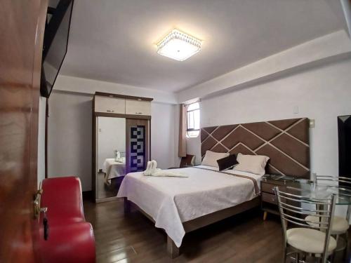 Llit o llits en una habitació de Princess Hotel