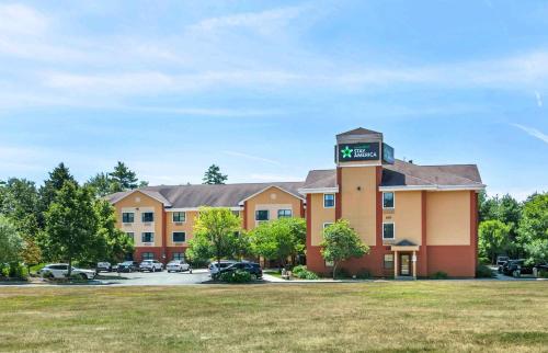 a hotel with a clock tower on top of it at Extended Stay America Suites - Portland - Scarborough in Scarborough