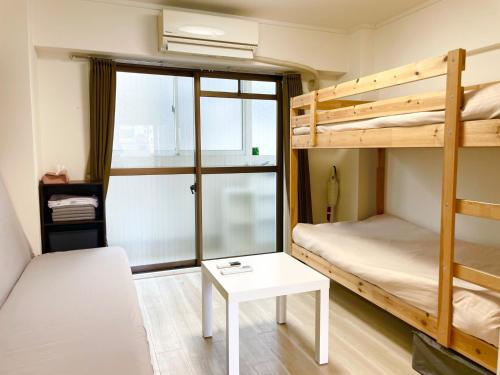 Giường trong phòng chung tại Sunrise Mansion - Vacation STAY 14387