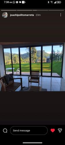 a picture of a room with a bench and a window at Recanto do Daniel in Irati