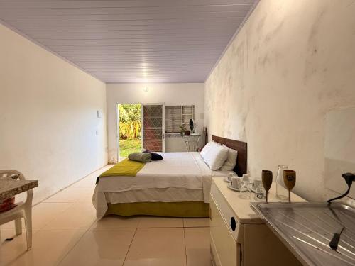 En eller flere senge i et værelse på Caminito Brasilia Hostel